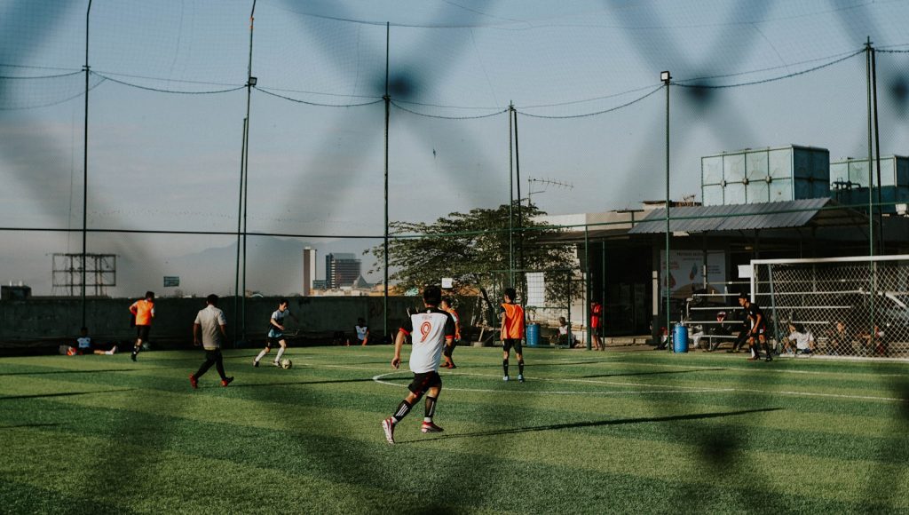a group of people playing a game of soccer