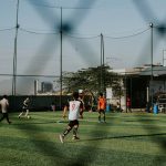 a group of people playing a game of soccer
