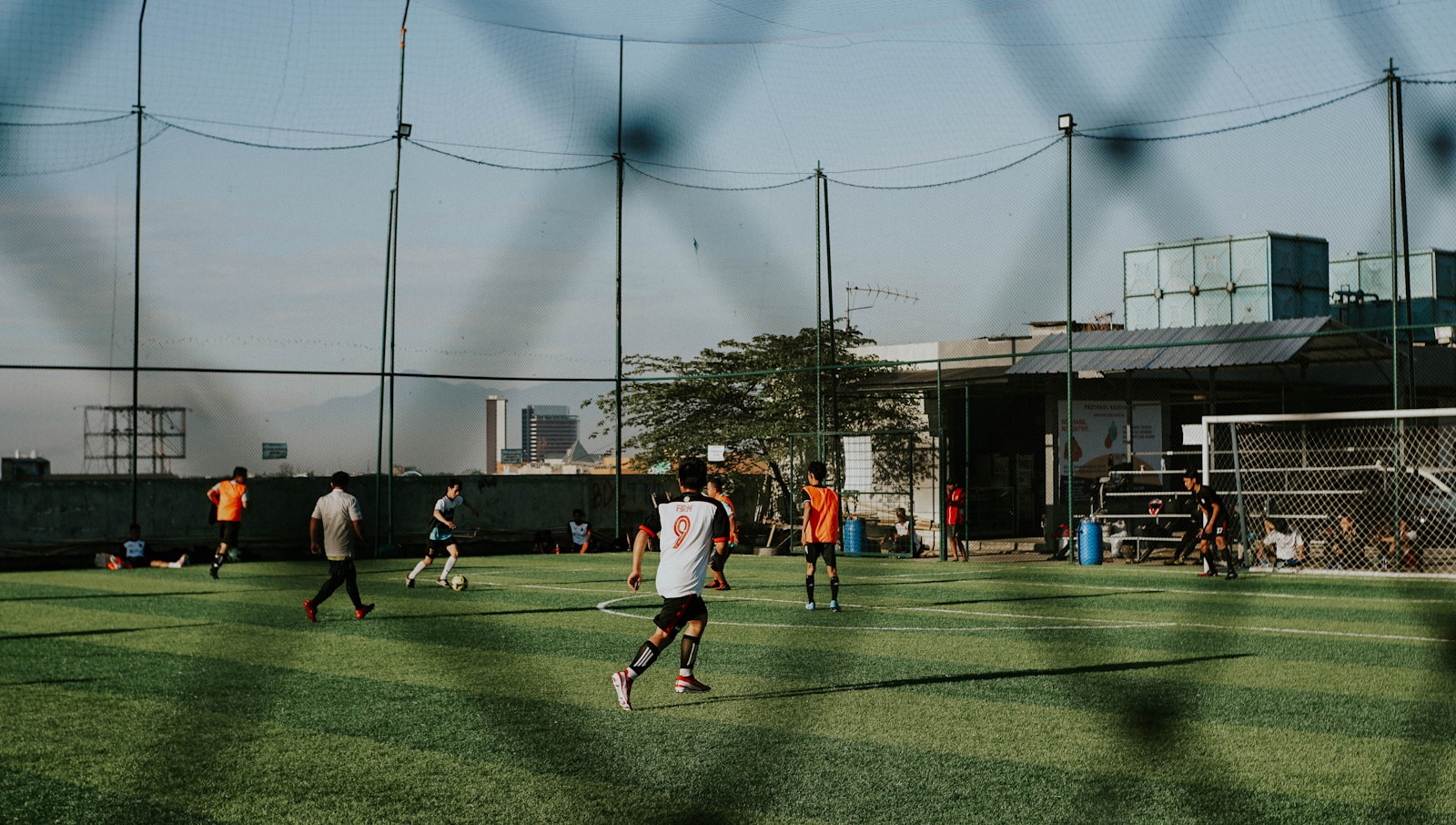 a group of people playing a game of soccer